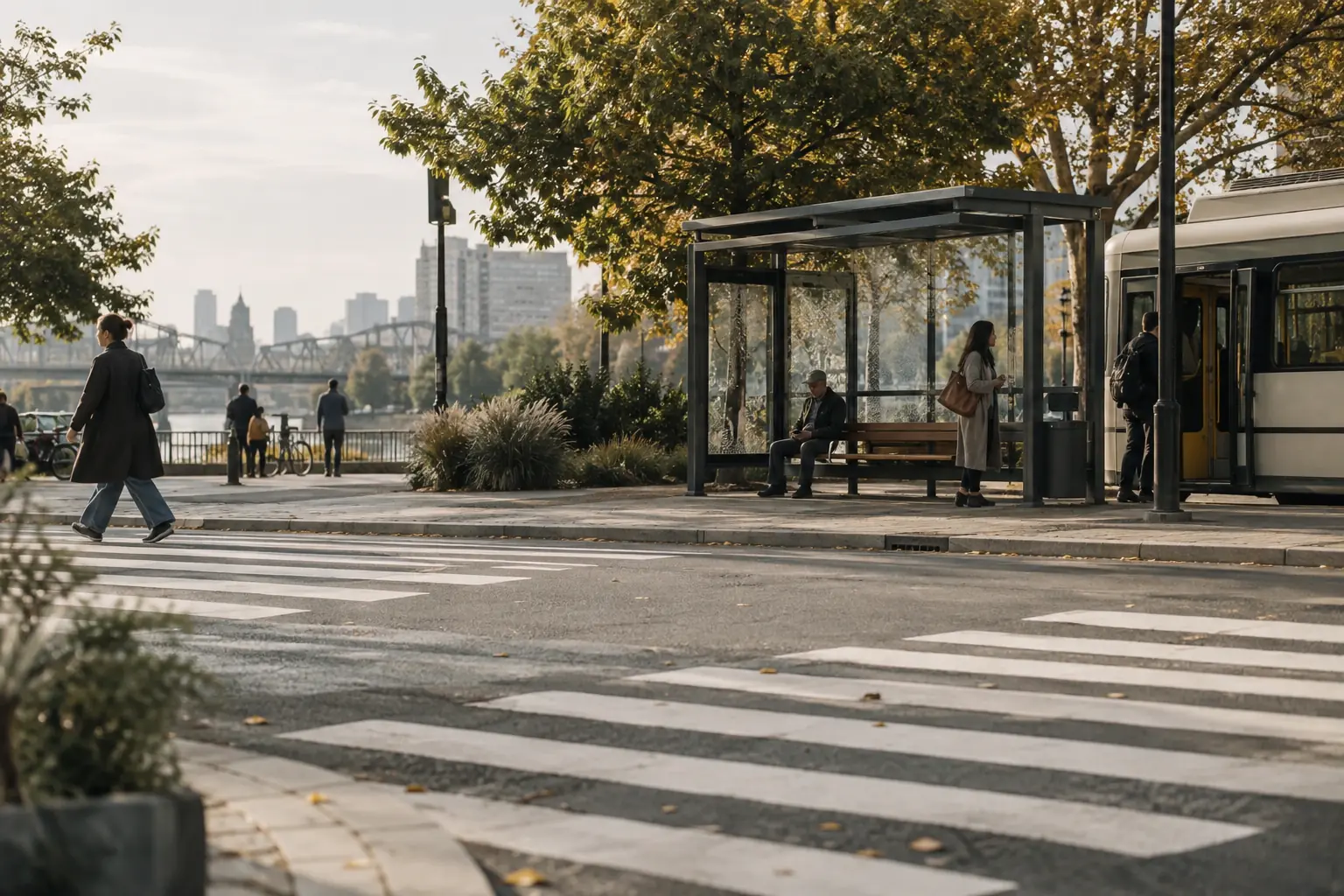 A city bus stop beside a crosswalk with pedestrians and traffic